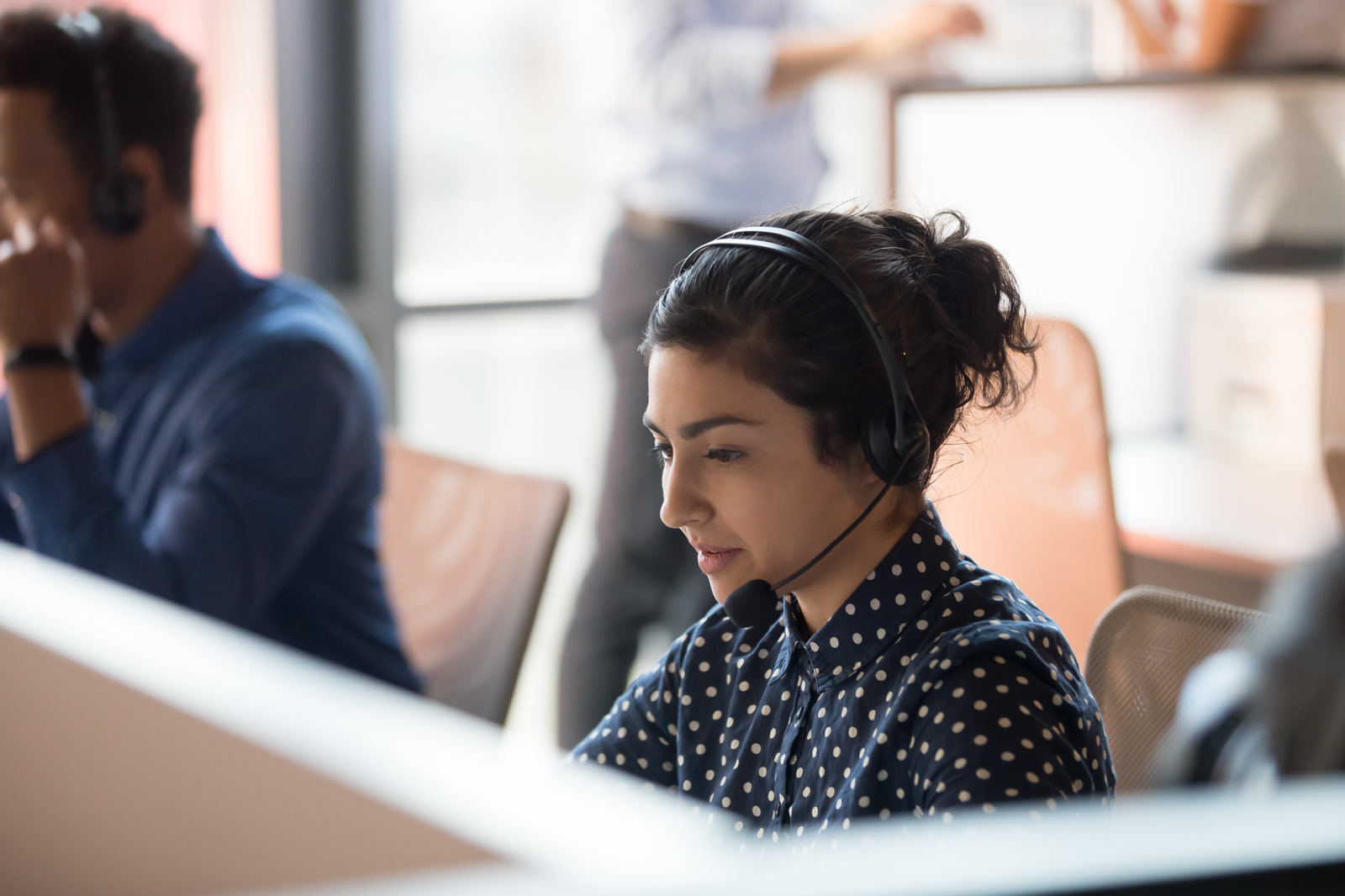 Agent on a headset working a live conversation